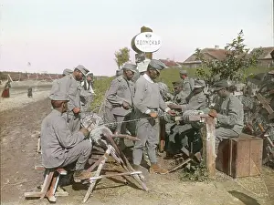 Tighten: Soldiers tighten razor wire