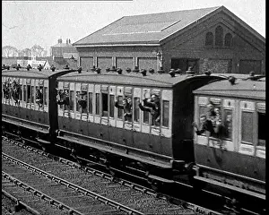 Departs: Soldiers Waving From the Windows of a Train