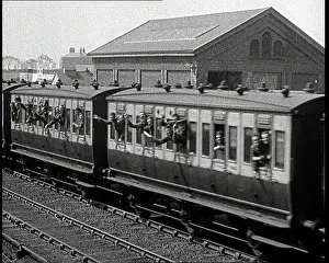 Departs: Soldiers Waving From the Windows of a Train