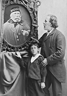 Respectively: The son and grandson with a painting of Giuseppe Garibaldi