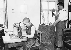 Stamping: Son helping his father at work, 1907