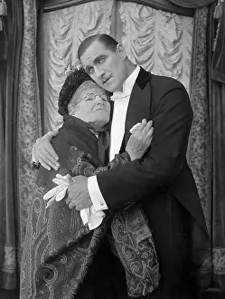 Supportive: Son hugging elderly mother