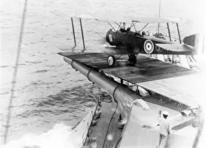 Strutter: Sopwith 1? Strutter biplane taking off from a ship, WW1