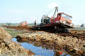 Swampy: Soviet Khaski marsh buggy laying oil pipeline, 1978