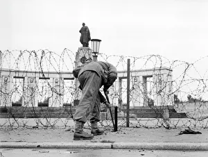 Fenced: Soviet memorial in Berlin is fenced off by British troops