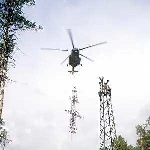 Transmission: Soviet Mil Mi-8 helicopter carrying power line pylon, 1976