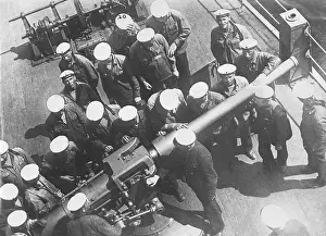 Instructed: Soviet sailors receive a lesson about the ship's gun