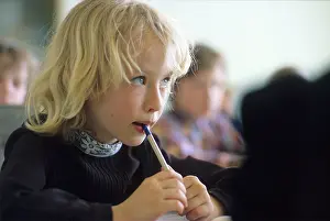 Chewing: Soviet schoolgirl at lesson, 1979