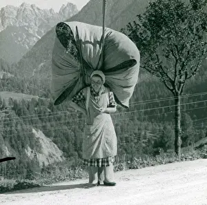 Massive: Spanish woman carrying a massive bundle of hay