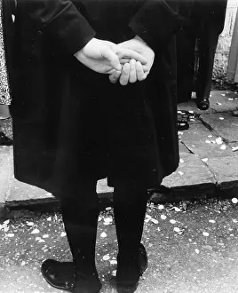 Confetti: Spectator at a wedding, with confetti on the ground