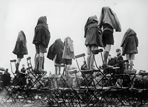 Exalted: Spectators in rain
