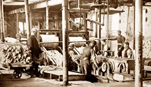 Squeezing: A squeezing machine, linen production, Victorian period