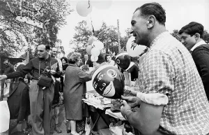 Krish: Stall holder selling balloons at a fairground