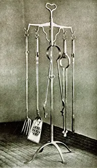 Shovel: Stand of fire irons in polished wrought iron