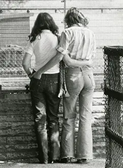 Shirley Baker: Standing couple - rear view - at the Zoo