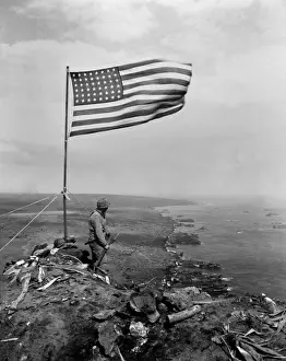 Offensives: Stars and Stripes wave over the summit of Mt