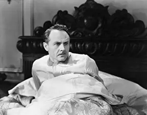 Mustaches: Startled man sitting up in bed