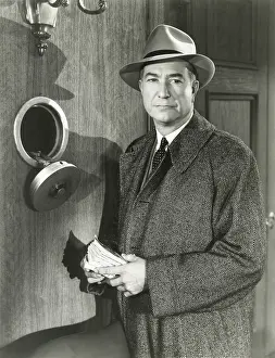 Safekeeping: Stashing cash in secret safe -