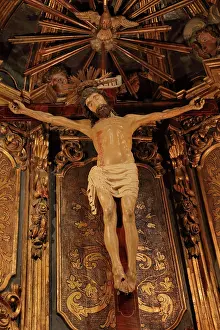 Blend: Statue of Christ on the cross in a chapel in the