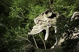 Orsini: Statue of dragon, Garden of Bomarzo, Bomarzo, Lazio, Italy