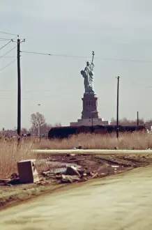 Dumping: Statue of Liberty seen from the dump in ?