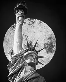 Immigrating: Statue of Liberty Shown from Bust up Full Moon in Backgro