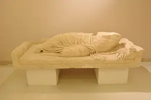 Reclining: Statue of a reclining man. Greece