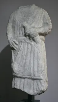 Lusitania: Statue of a young man carrying an offering (a