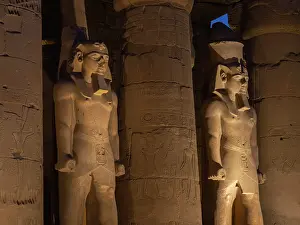 Floodlighting: Statues of Ramesses II, Luxor Temple, Luxor, Egypt