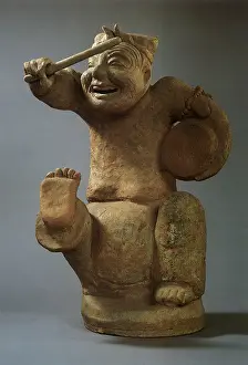 Grin: Statuette of a Ballad Singer playing a Drum