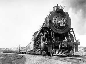 Rounding: A steam engine on the American railway rounding a curve