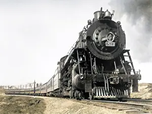 Rounding: A steam engine on the American railway rounding a curve