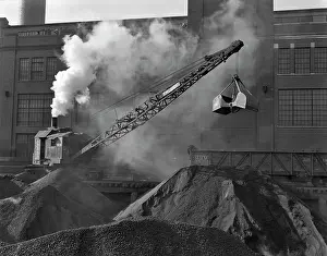 Steam Powered: Steam Engine Clamshell Crane Loading Mounds of Asphalt