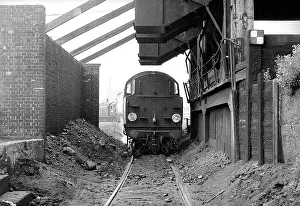 Elms: Steam engine under coaling stage at Nine Elms Loco yard