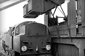 Elms: Steam engine under coaling stage at Nine Elms Loco yard