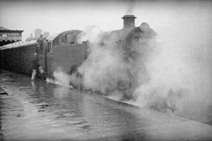 Enveloped: Steam engine at a station on the Redhill Reading line