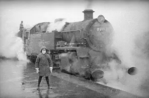 Enveloped: Steam engine at a station on the Redhill Reading line