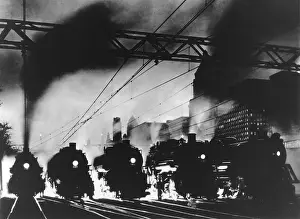 Large Scale: Five steam locomotives, side by side, outbound from