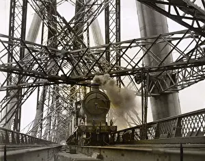 Powering: Steam train powering over the Forth Bridge
