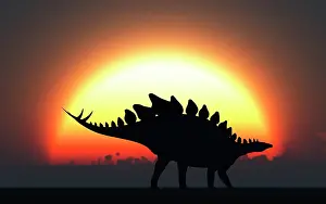 Stegosaurus: A Stegosaurus silhouetted against the setting Sun at the ?