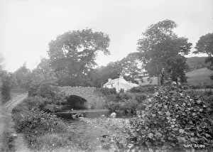 Cushendall: A stone arched bridge and building, Glenballyemon, Cushendal