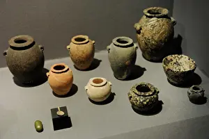 Spoon: Stone jars and bowls with a small spoon and a small grinding