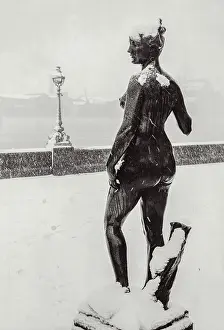 Stone statue, nude, in snow London