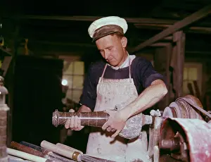 Stonemason: Stonemason working with granite in a workshop