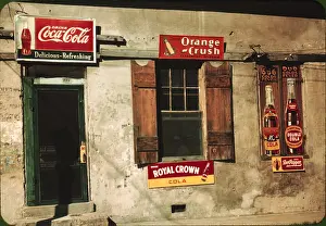 Natchez: A store or cafe with soft drink signs: Coca-Cola, ?