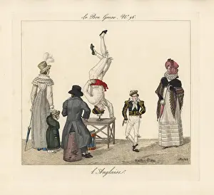 Langlaise: Street entertainer balancing on his head on a table