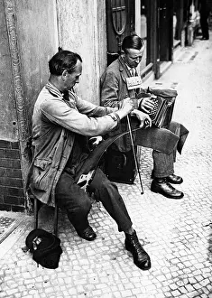 Need: Two street musicians, 1931