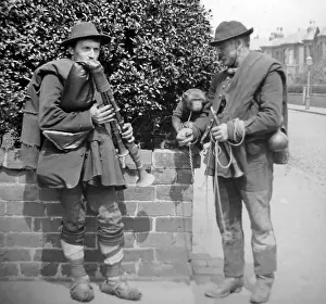 Busking: Street musicians with bagpipes and monkey