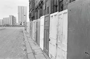 Boarded: Street scene with building awaiting demolition