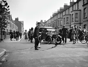 Gutter: Street scene with damaged car